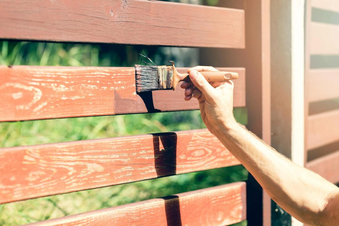 painting the fence brown